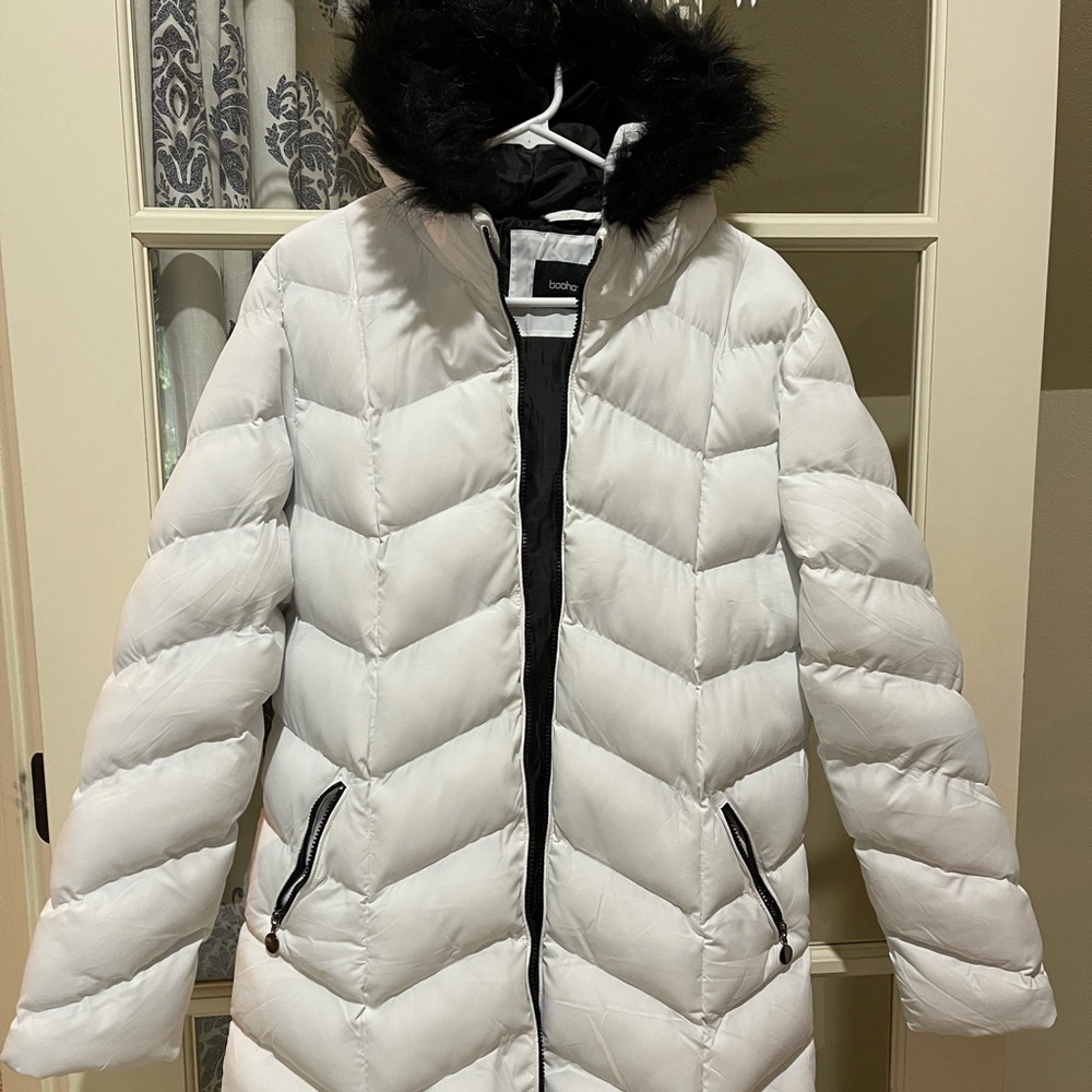 Long white puffy coat with black trim
